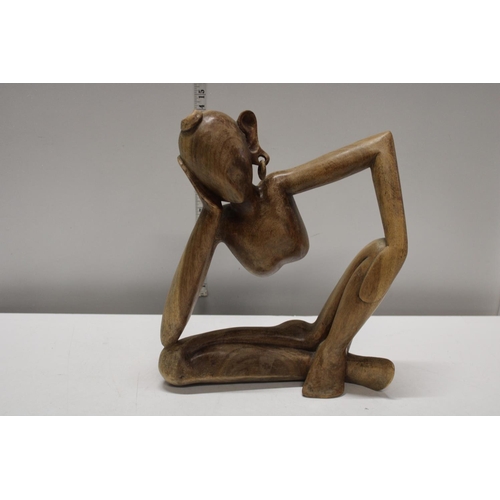 234 - A hand carved contemporary wooden figure