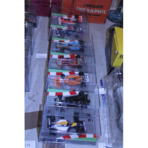 237 - Seven boxed die-cast formula one models