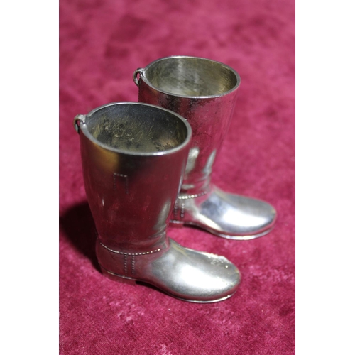 36 - A pair of heavy silver plated boots