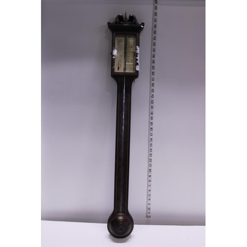 302 - A Georgian style stick barometer. small chip to top of wooden case. Postage unavailable