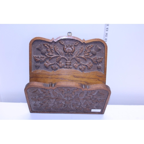 67 - A hand carved Oak wall hanging letter rack