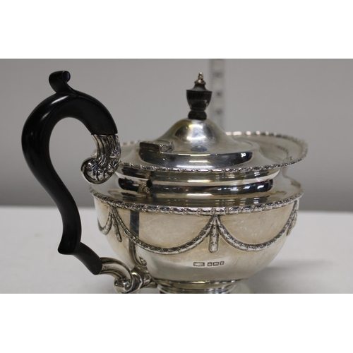 1 - A four piece sterling silver tea set; compromising of teapot, hot water jug, sugar and cream in a ci... 