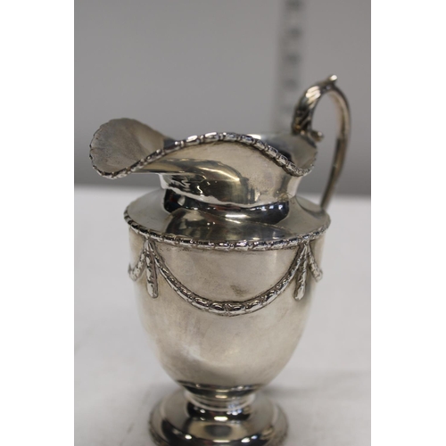 1 - A four piece sterling silver tea set; compromising of teapot, hot water jug, sugar and cream in a ci... 