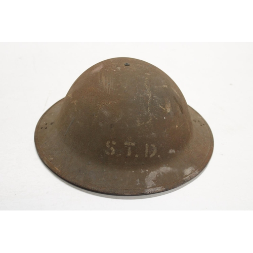 17 - A military helmet stamped STD