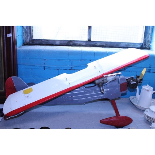 19 - A large model aeroplane with petrol engine, shipping unavailable