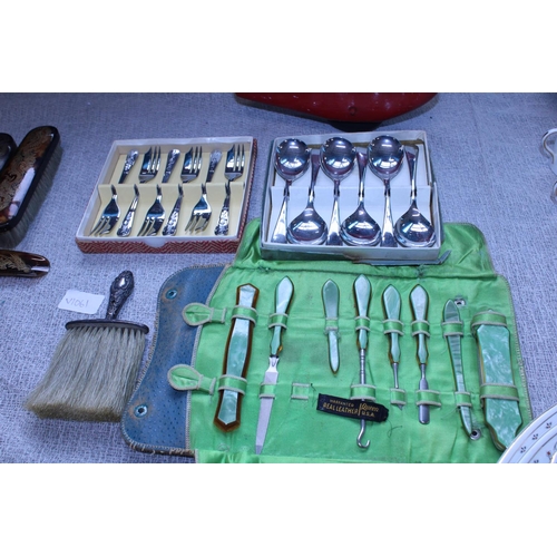 22 - A selection of vintage cutlery and manicure set with hallmarked silver brush