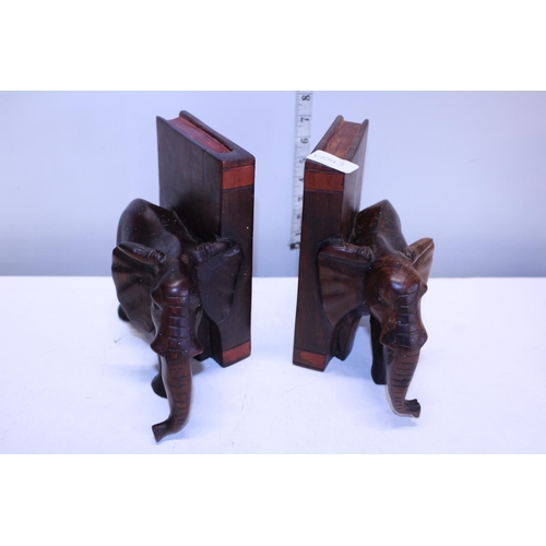 52 - A pair of elephant themed wooden book ends