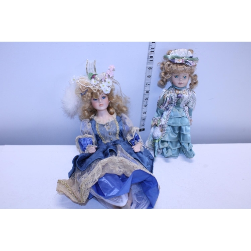 53 - Two porcelain headed dolls