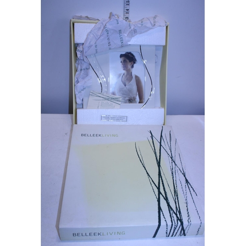 58 - A boxed Belleek porcelain photo frame