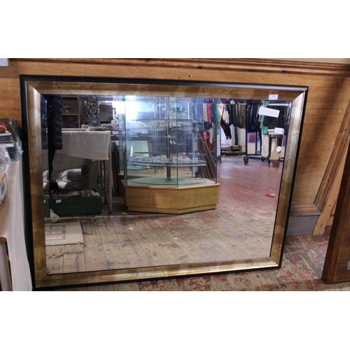 415 - A large contemporary bevelled edged mirror, 110cm x 84cm shipping unavailable