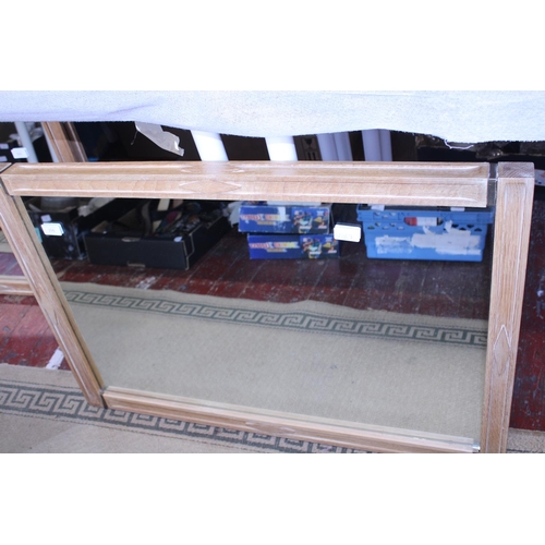 414 - A heavy contemporary oak framed mirror, shipping unavailable. 90cm x 62cm