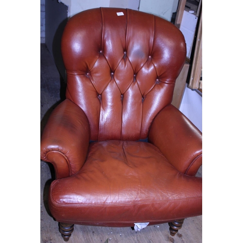 413 - A Victorian style leather arm chair. Postage unavailable