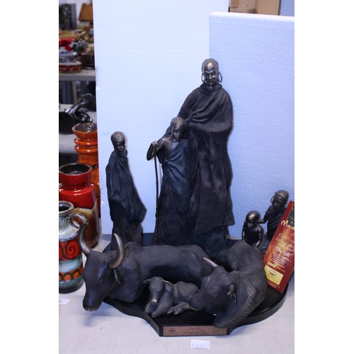 179 - Soul Journey figures on a presentation plinth entitled The Gift. Largest is 50cm tall.