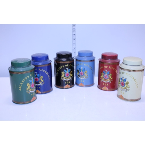 12 - A selection of vintage metal tea canisters