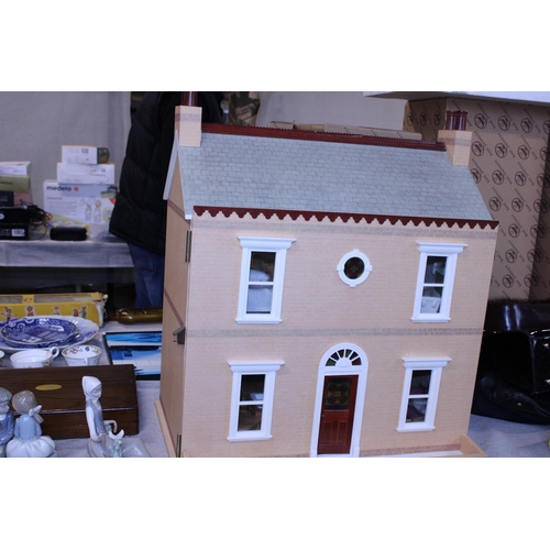 123 - A dolls house fully furnished.  Postage unavailable