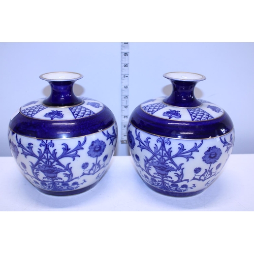 52 - A pair of antique James MacIntyre blue and white Florian style vases.