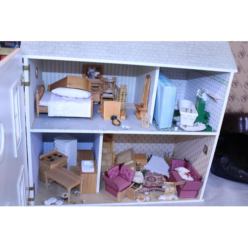 123 - A dolls house fully furnished.  Postage unavailable