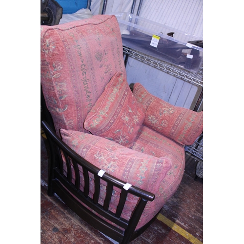 435 - A vintage Ercol armchair. With spindle back.  Postage unavailable