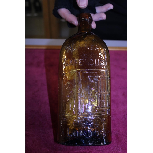 311 - A antique Warner's of London Safe Cure amber coloured bottled (slight chip to rim)