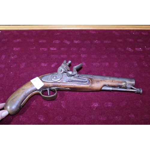 165 - A antique flintlock pistol marked Tower 1798 (slight damage to grip)