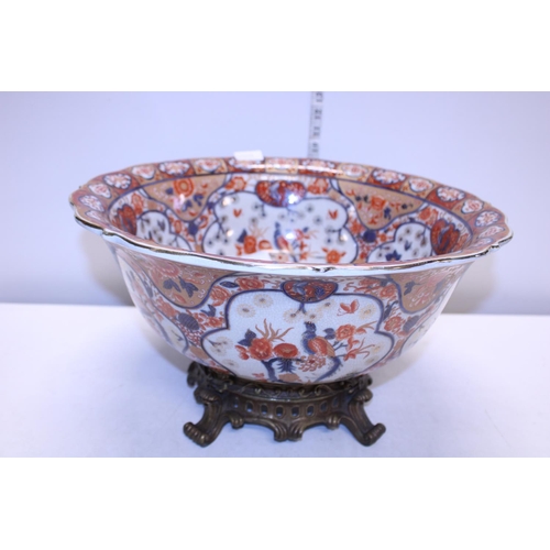 361 - A large ceramic late 19th century bowl on a heavy brass stand d44cm, shipping unavailable