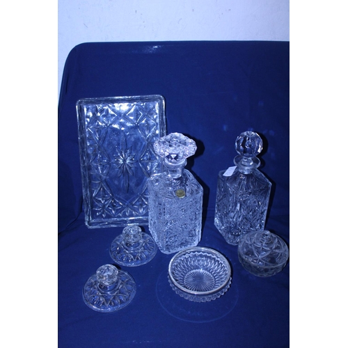 39 - A selection of cut glass including two decanters