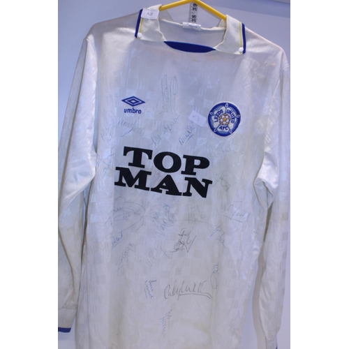 428 - A Leeds United Football shirt signed by the players from the late 1980's. From the collection of Ex ... 