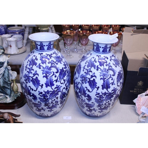 43 - A pair of decorative blue and white vases h42cm