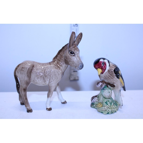 152 - Two small Beswick figures a donkey and bird