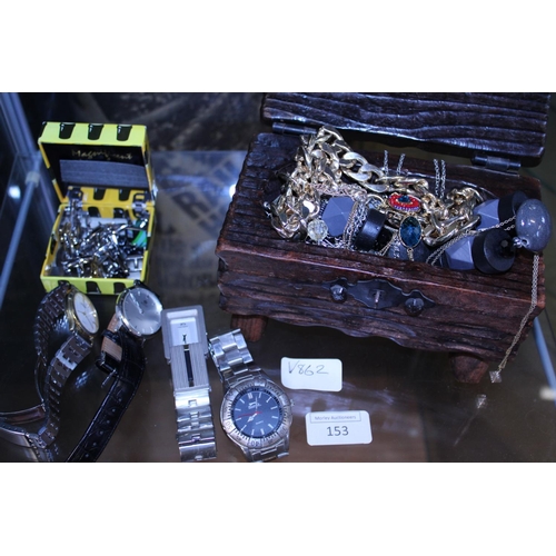 153 - A shelf of assorted costume jewellery including cufflinks and watches