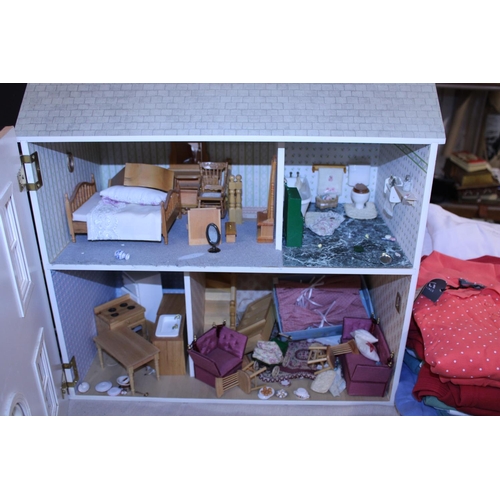 176 - A dolls house and contents of furniture, shipping unavailable