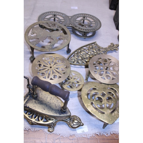 16 - A good selection of assorted brass trivets