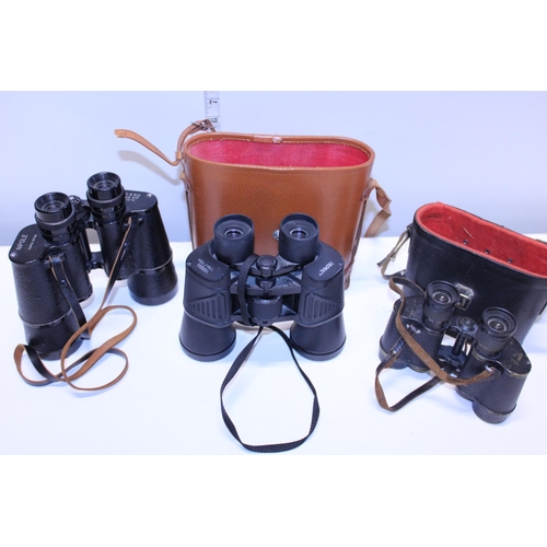 35 - Three pairs of vintage binoculars