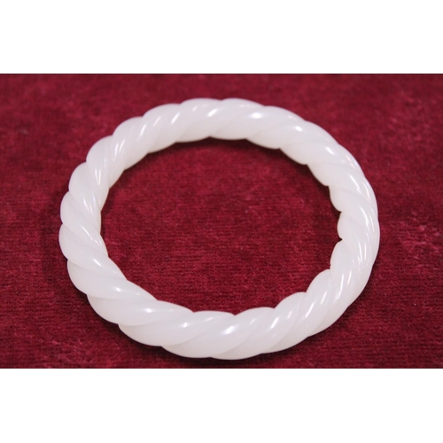 233 - A Chinese White Jade bracelet finely carved with twist design