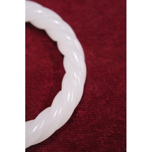 233 - A Chinese White Jade bracelet finely carved with twist design