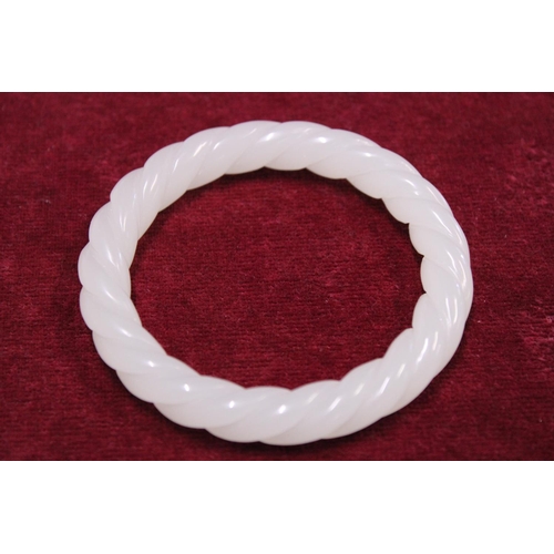 233 - A Chinese White Jade bracelet finely carved with twist design