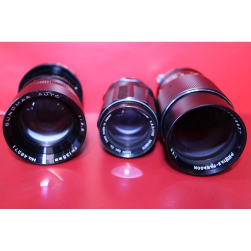 312 - Three assorted camera lenses