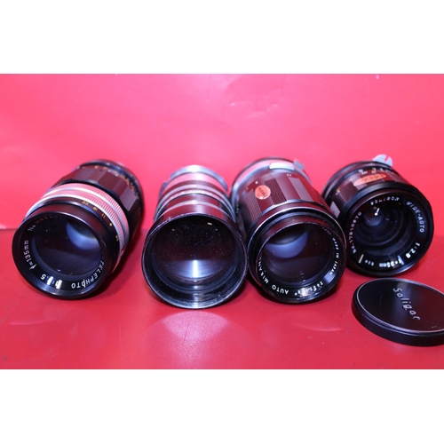 313 - Four assorted camera lenses