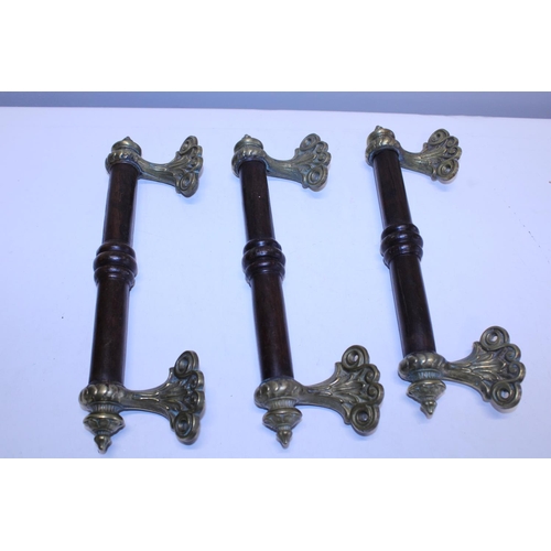 350 - Three Victorian brass and mahogany door handles