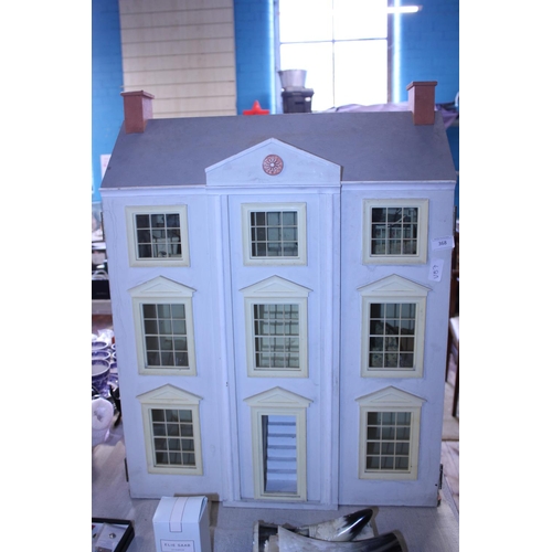 368 - A large vintage dolls house. Shipping unavailable.