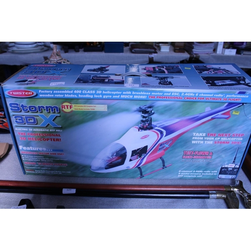 124 - A boxed Storm 3DX helicopter (untested) looks complete