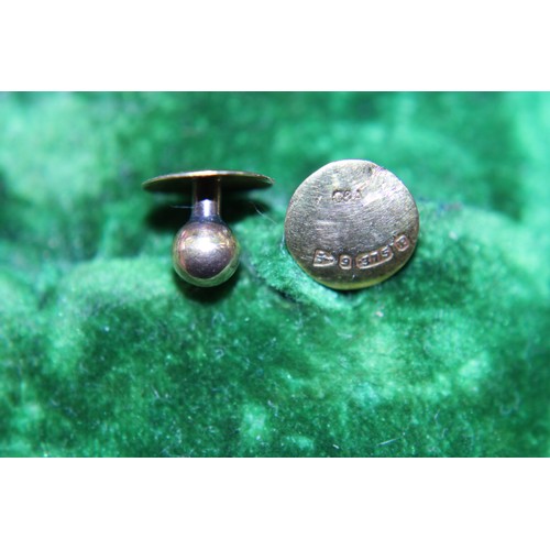 244 - A pair of hallmarked 9ct gold shirt studs 0.73g