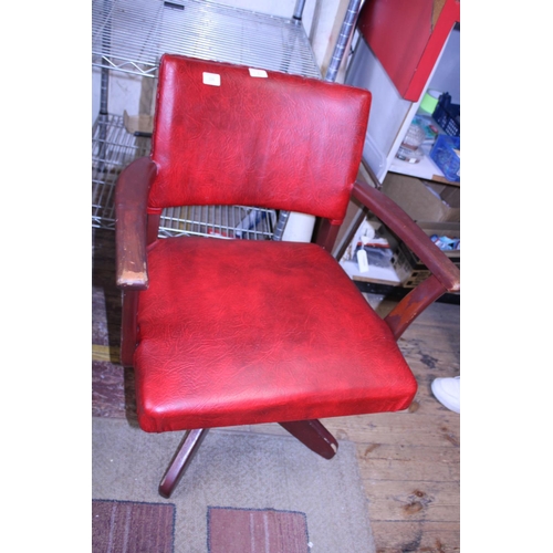 277 - A mid-century red upholstered swivel chair, shipping unavailable