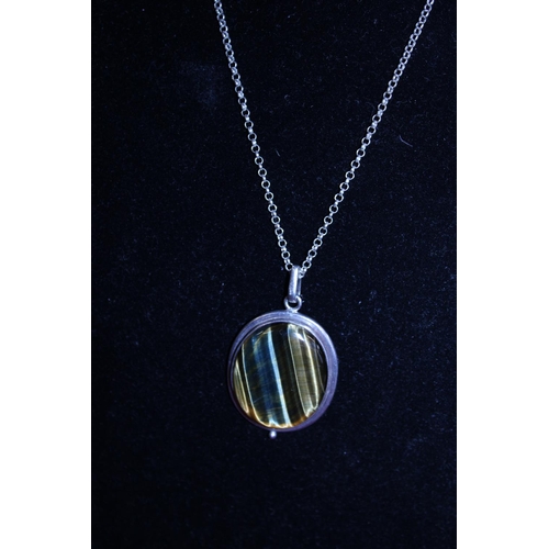 98 - A 925 silver chain with a white metal and hardstone pendant