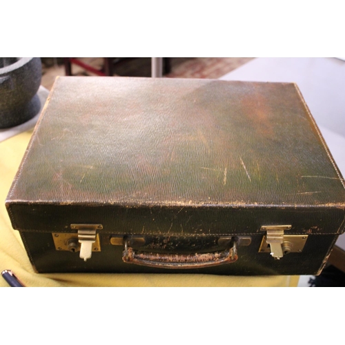 135 - A hallmarked silver mounted Gentlemen's vanity case retailed by Harrods. (some dents to silver lids ... 