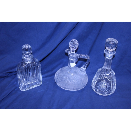 136 - Three assorted cut glass decanters