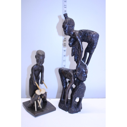 142 - Two hand carved African wooden figures