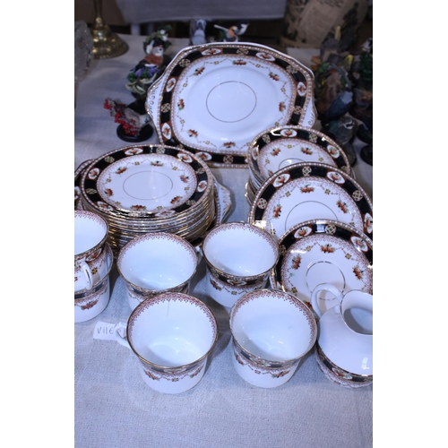 143 - A Reid's bone china tea service (32 pieces) (one cup hairline crack, slight rub to gilt)