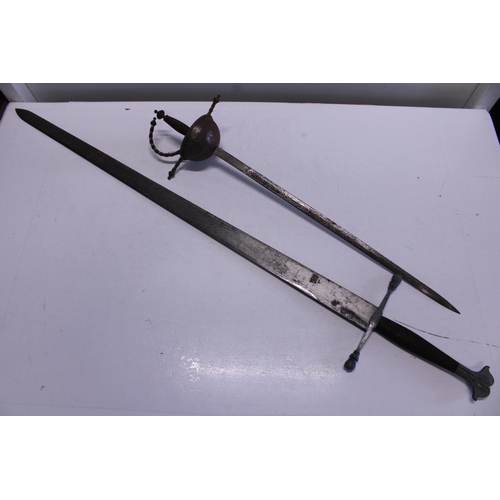 206 - A well made Medieval style broadsword and a later cutlass style sword, shipping unavailable