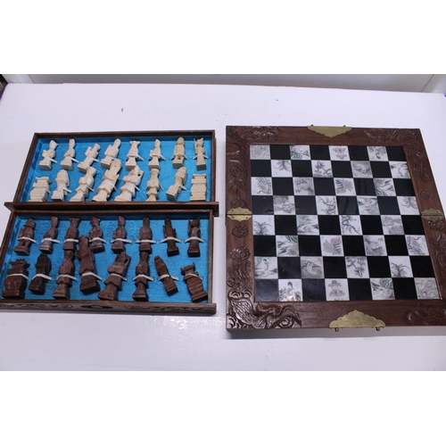 266 - A set of wooden chess pieces complete with board